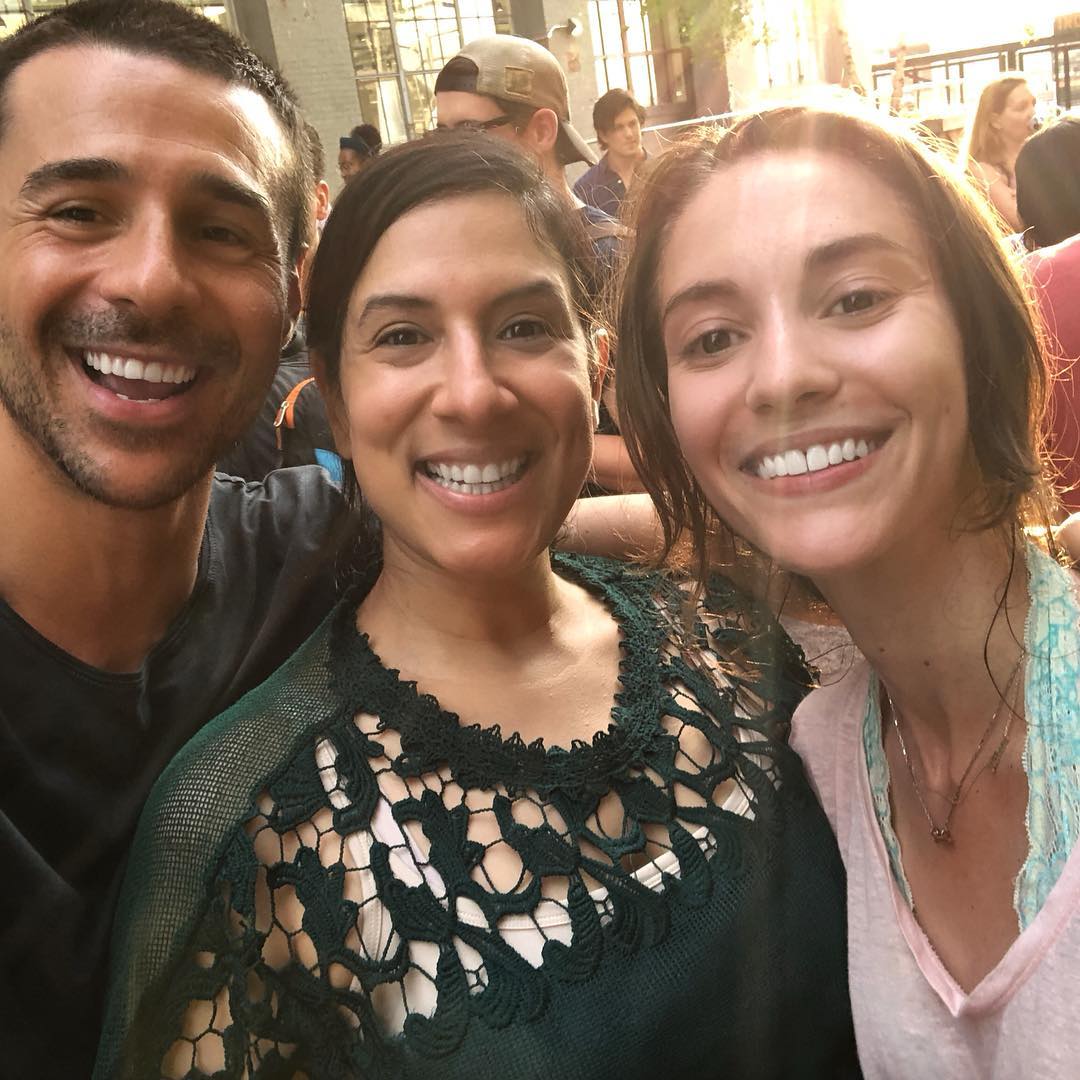 Three people smiling and taking a selfie outdoors, clearly enjoying a break from Second-Year-Itis. The person on the left has short dark hair and a dark shirt, the one in the middle sports long dark hair with a green top, while on the right is someone with long light brown hair and a light shirt.