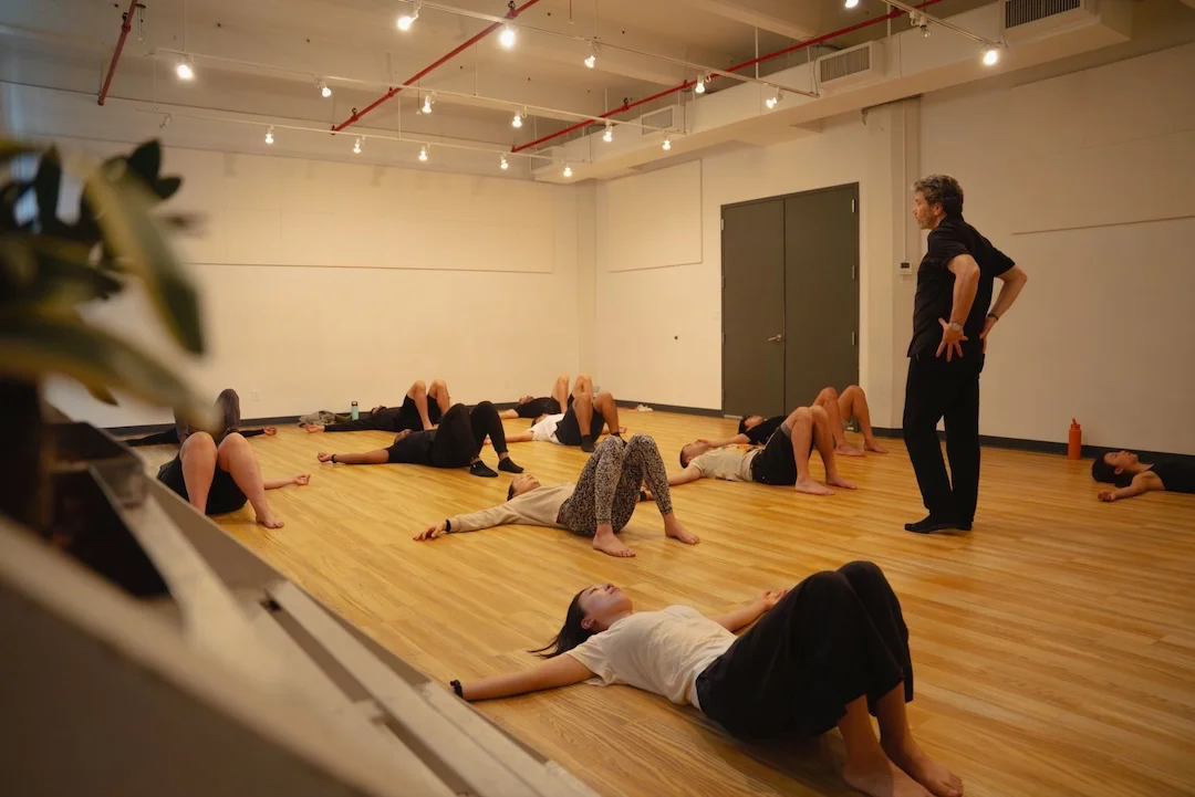 Actors practicing breath and body awareness during voice training at Terry Knickerbocker Studio