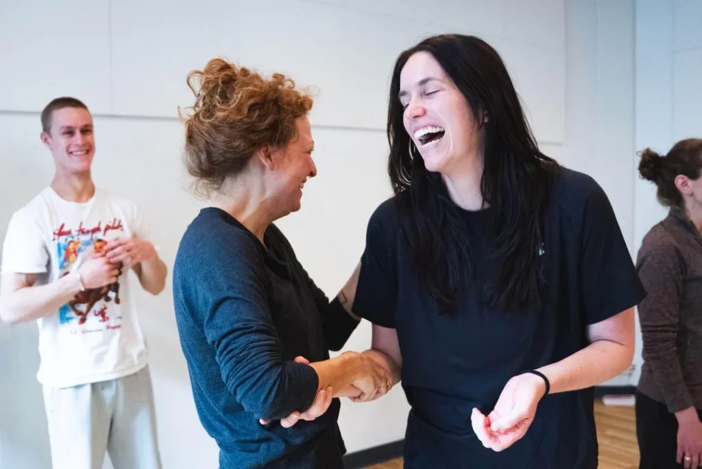 Acting student practicing focused scene work while an instructor observes during a professional acting class at TKS.